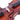 Close-up of a violin's f-hole and bridge on a white background